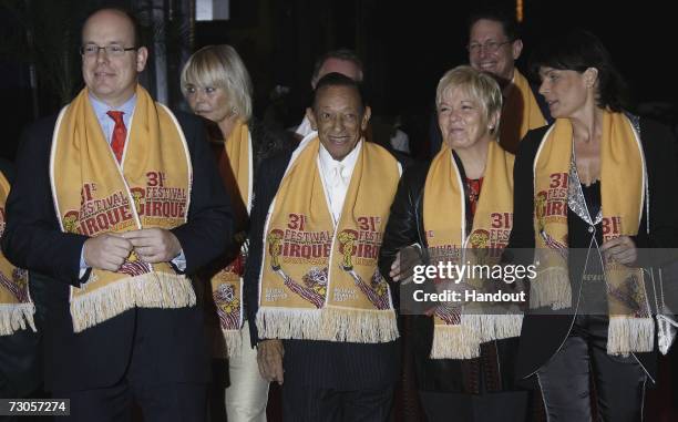 In this handout image released by Monaco Palace, Prince Albert of Monaco, French singer Henri Salvador, unidentified guest, Princess Stephanie of...