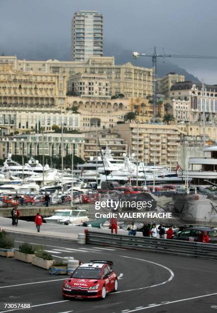 French driver Sebastien Loeb steers his Citroen C4 WRC during the Monte-Carlo Rally 75th edition last stage, 21 January 2007 in Monaco. Loeb won the...