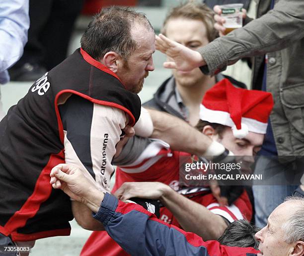 Toulouse's Irish player Trevor Brennan punches an Ulster's fans during the European cup rugby union match Toulouse vs. Ulster , 21 January 2007 at...