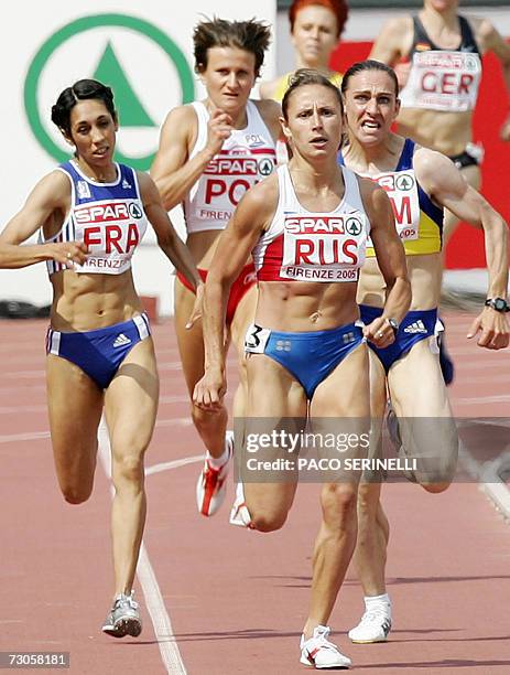 File photo taken 19 June 2005 shows Yulia Chizhenko of Russia , Bouchra Ghezielle of France and Maria Cioncan of Romania competing in the 1,500m...