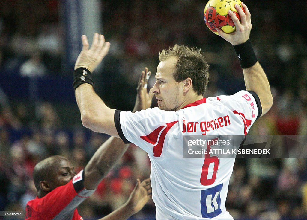 Danish Lars Jorgensen scores past Angola's Manuel Dias during their ...