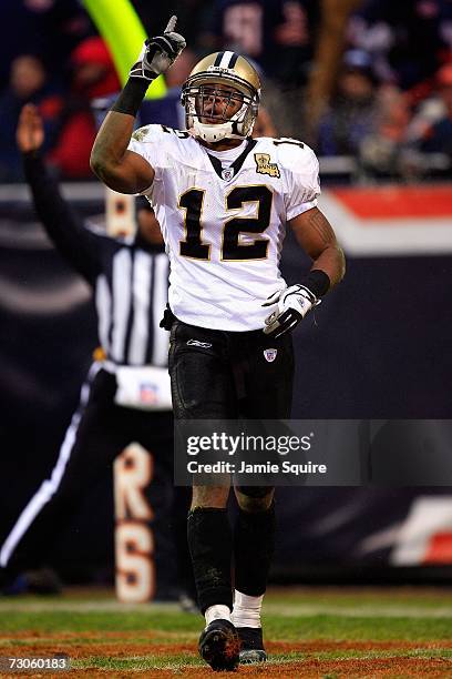 Marques Colston of the New Orleans Saints celebrates his touchdown catch in the second quarter against the Chicago Bears during the NFC Championship...