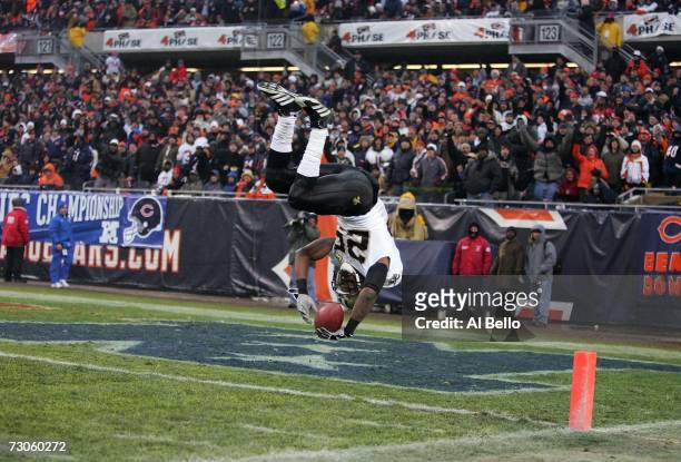 Reggie Bush of the New Orleans Saints flips into the end zone on an 88-yard touchdown reception in the third quarter against the Chicago Bears during...