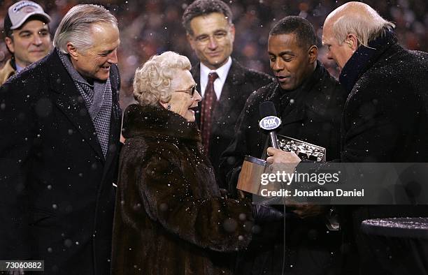 Virginia McCaskey, team owner of the Chicago Bears and her son Michael McCaskey receive the George S. Halas trophy from Hall of Fame running back...