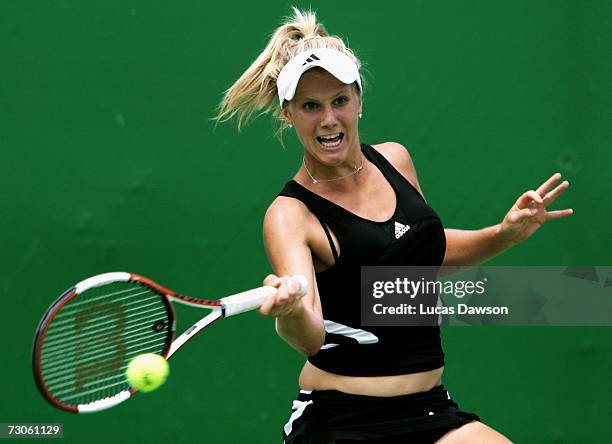 Isabella Holland of Australia plays a forehand during her first round juniors match against Nadiya Kichenok of the Ukraine on day eight of the...