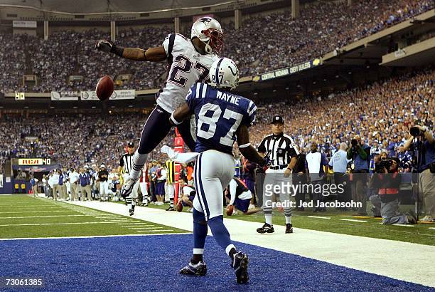 Reggie Wayne of the Indianapolis Colts is blocked by Ellis Hobbs of the New England Patriots for an incomplete pass in the third quarter of the AFC...