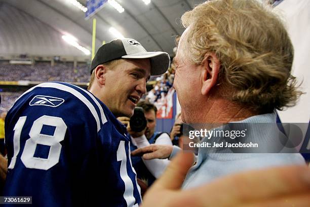 Quarterback Peyton Manning of the Indianapolis Colts is congratulated by his father Archie Manning after defeating the New England Patriots 38-34 in...