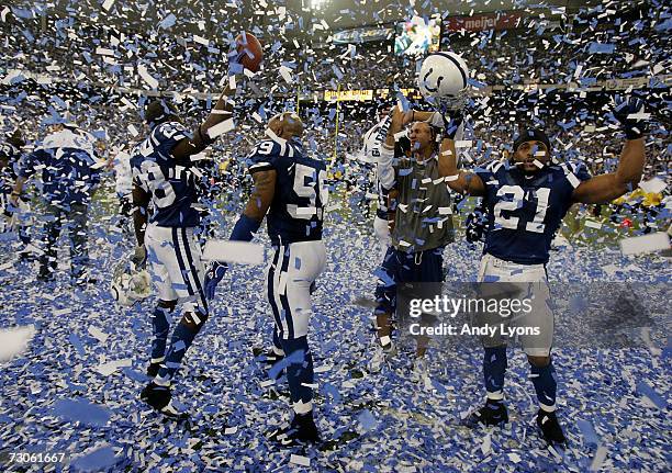 Marlin Jackson, Cato June and Bob Sanders of the Indianapolis Colts celebrates amongst confetti after their team defeated the New England Patriots...