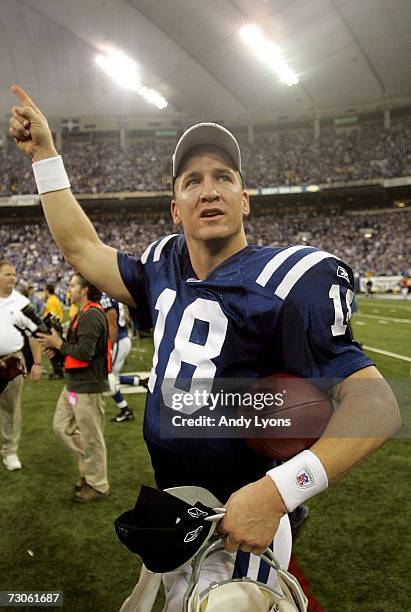 Quarterback Peyton Manning of the Indianapolis Colts walks off the field after defeating the New England Patriots 38-34 in the AFC Championship Game...