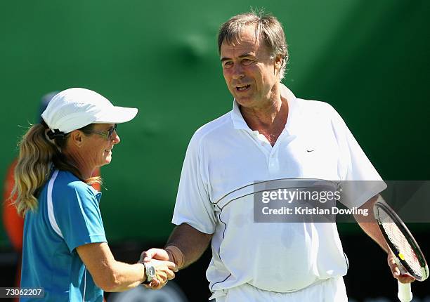 Former Australian tennis players John Alexander congratulates Di Balestrat during a mixed doubles legends match against Ross Case and Nicole Bradtke...