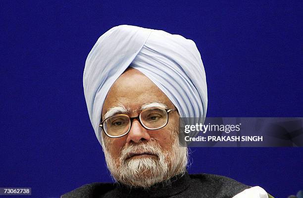 Indian Prime Minister Manmohan Singh listens to a speech during a chief ministers conference on pension reforms in New Delhi, 22 January 2007. Prime...