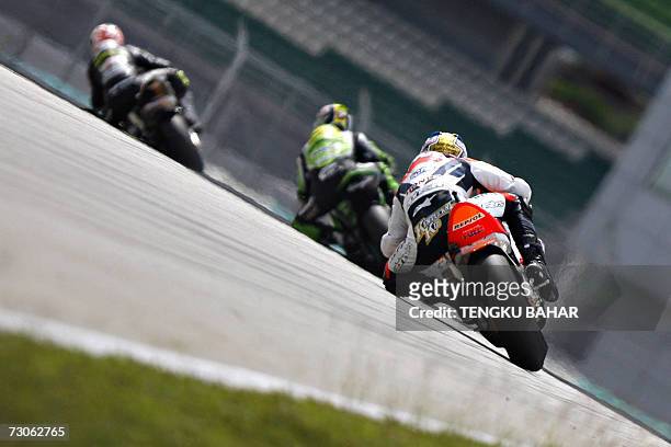 MotoGP champion Nicky Hayden leans his Honda into a turn during pre-season testing at the Sepang International Racing Circuit in Sepang, 22 January...