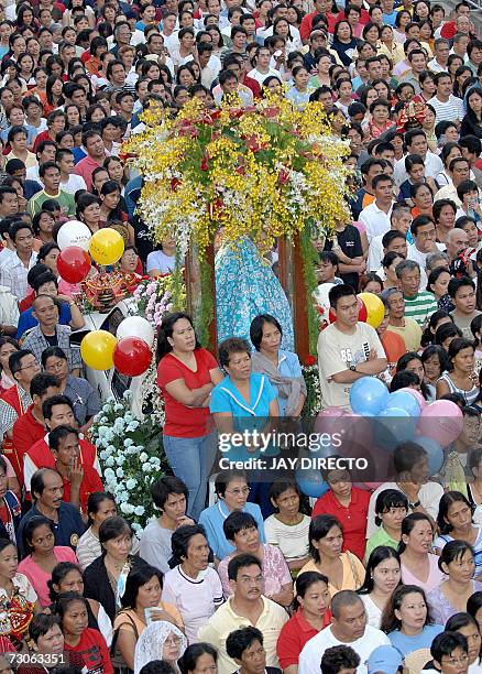 Devotees attend a mass at the Basilica Del Santo Nino in Cebu city, 19 January 2007. The mass is part of a nine-day religious festival but the main...