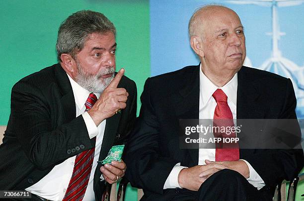 Brazilian President Luiz Inacio Lula da Silva gestures next to Vice President Jose Alencar during the launching of the "Acceleration Programme for...