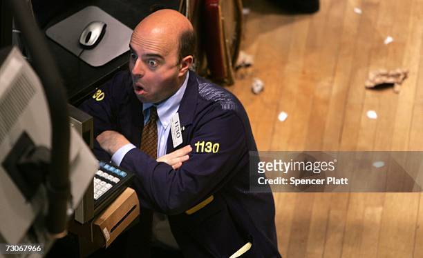 Trader works on the floor of the New York Stock Exchange in the financial district January 22, 2007 in New York City. In a study commissioned by New...
