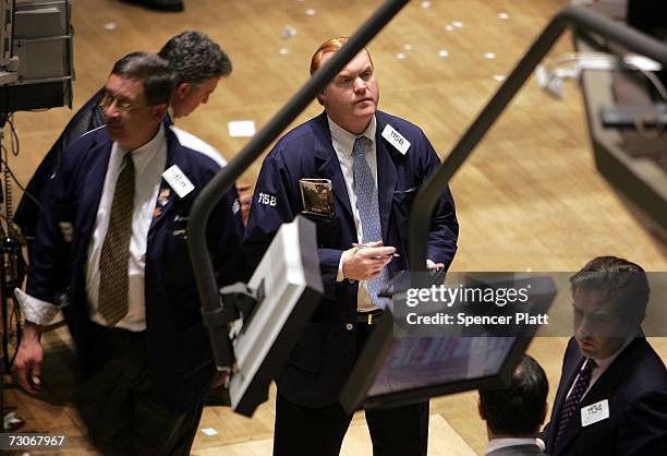 Traders work on the floor of the New York Stock Exchange in the financial district January 22, 2007 in New York City. In a study commissioned by New...