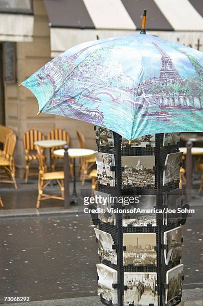 "postcards at tourist stand, paris, france" - paris postcard stock pictures, royalty-free photos & images