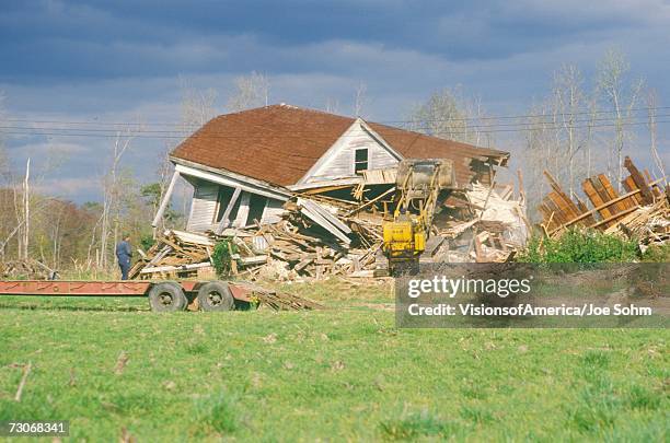 "old farmhouse being bulldozed, de" - raze stock pictures, royalty-free photos & images