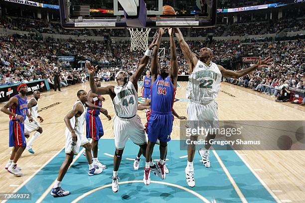 Jason Maxiell of the Detroit Pistons puts the ball up between Marc Jackson Cedric Simmons of the New Orleans/Oklahoma City Hornets on January 4, 2007...