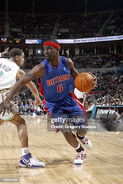 Ronald Murray of the Detroit Pistons drives to the basket against Jannero Pargo of the New Orleans/Oklahoma City Hornets on January 4, 2007 at the...