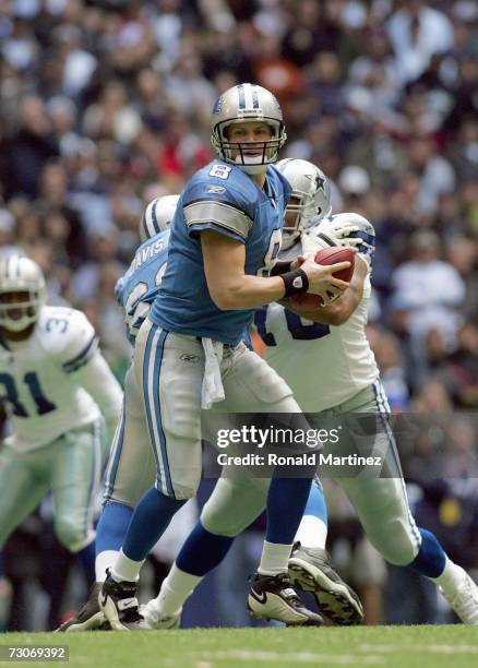 Quarterback Jon Kitna of the Detroit Lions looks to pass the ball during the game against the Dallas Cowboys at Texas Stadium at Texas Stadium on...