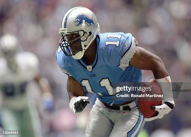 Roy Williams of the Detroit Lions carries the ball during the game against the Dallas Cowboys at Texas Stadium at Texas Stadium on December 31, 2006...