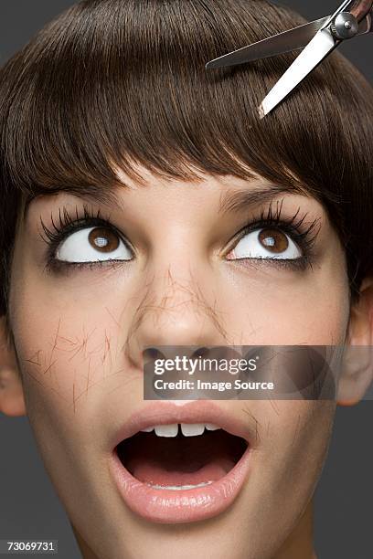 young woman having a haircut - hairstyle bildbanksfoton och bilder