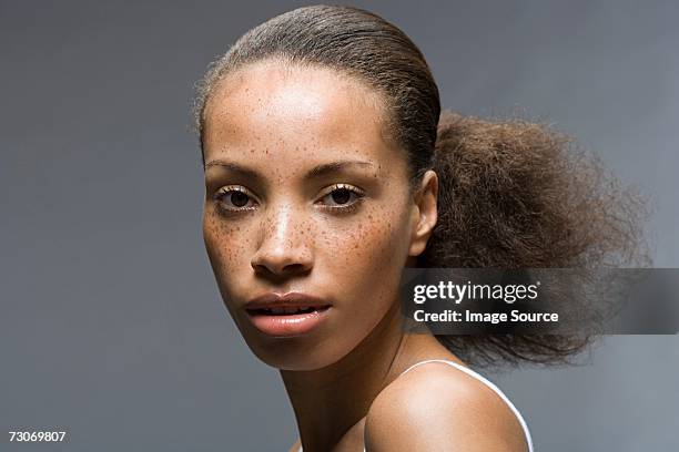 young woman with frizzy ponytail - frizzy stock pictures, royalty-free photos & images