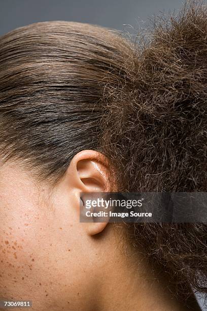 woman with frizzy ponytail - frizzy stock pictures, royalty-free photos & images