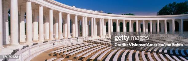 these are the marble columns and the amphitheatre at arlington national cemetery. below the columns are bench seats. - civic buildings stock pictures, royalty-free photos & images