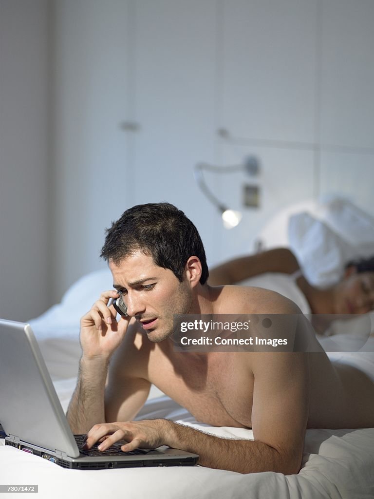 Man working as wife sleeps