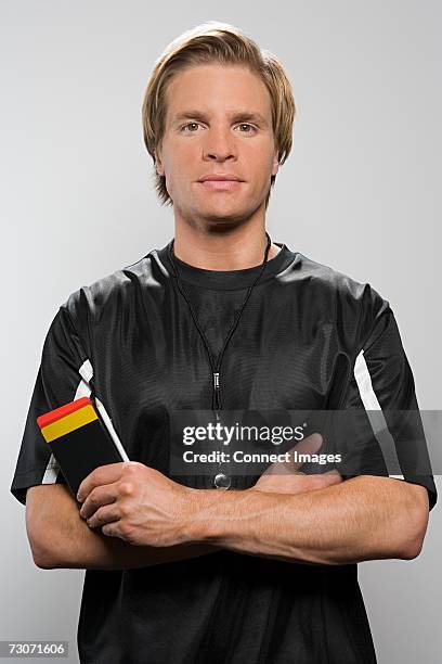 referee holding red and yellow card - referee portrait stock pictures, royalty-free photos & images