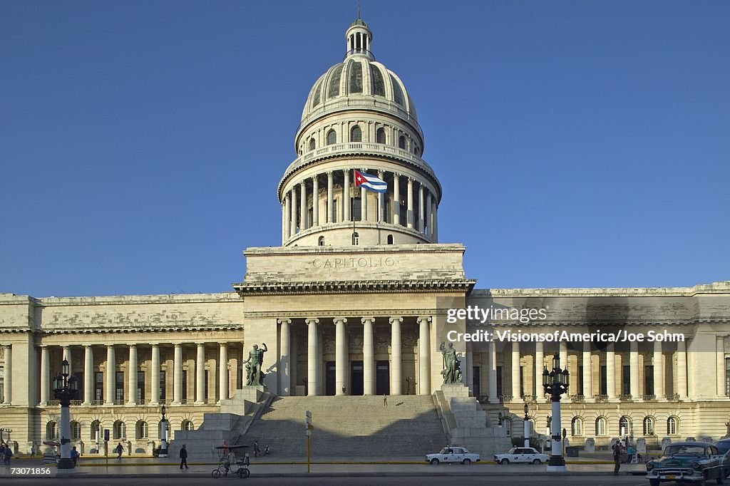 "Morning light on the Capitolio and Cuban Flag, the Cuban capitol building and dome in Havana, Cuba"