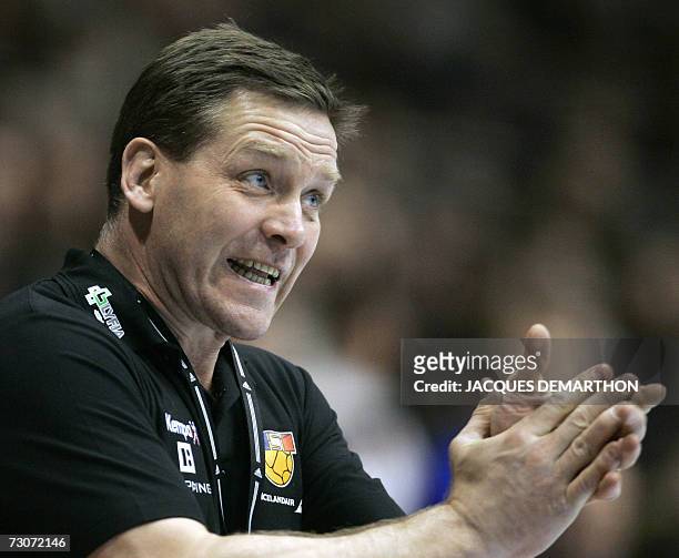 Iceland's head coach Alfred Gislason encourages his players during their France-Iceland group B match, of the preliminary round of the Men's Handball...