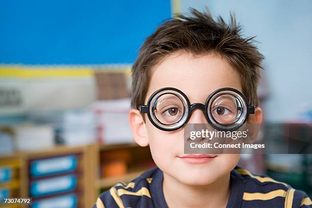 boy wearing novelty glasses - thick stock pictures, royalty-free photos & images