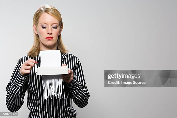 businesswoman shredding paper - paper shredder on white stock pictures, royalty-free photos & images