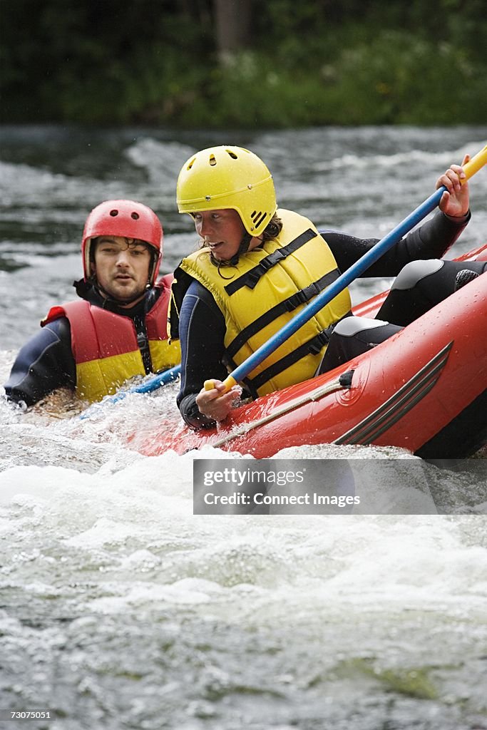 Two people white water rafting