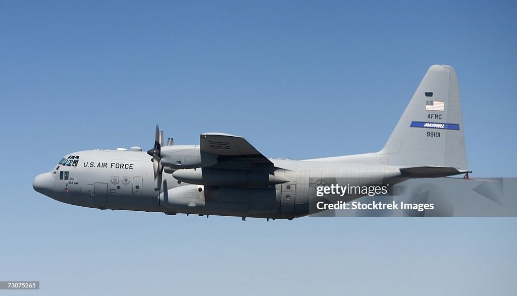 A specially modified C-130 Hercules flies over the Texas countryside September 19, during its initial test flight.