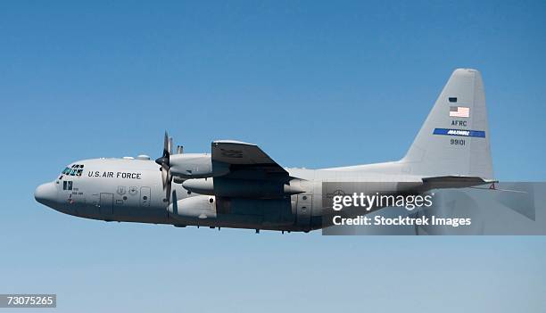a specially modified c-130 hercules flies over the texas countryside september 19, during its initial test flight. - hercules fotografías e imágenes de stock