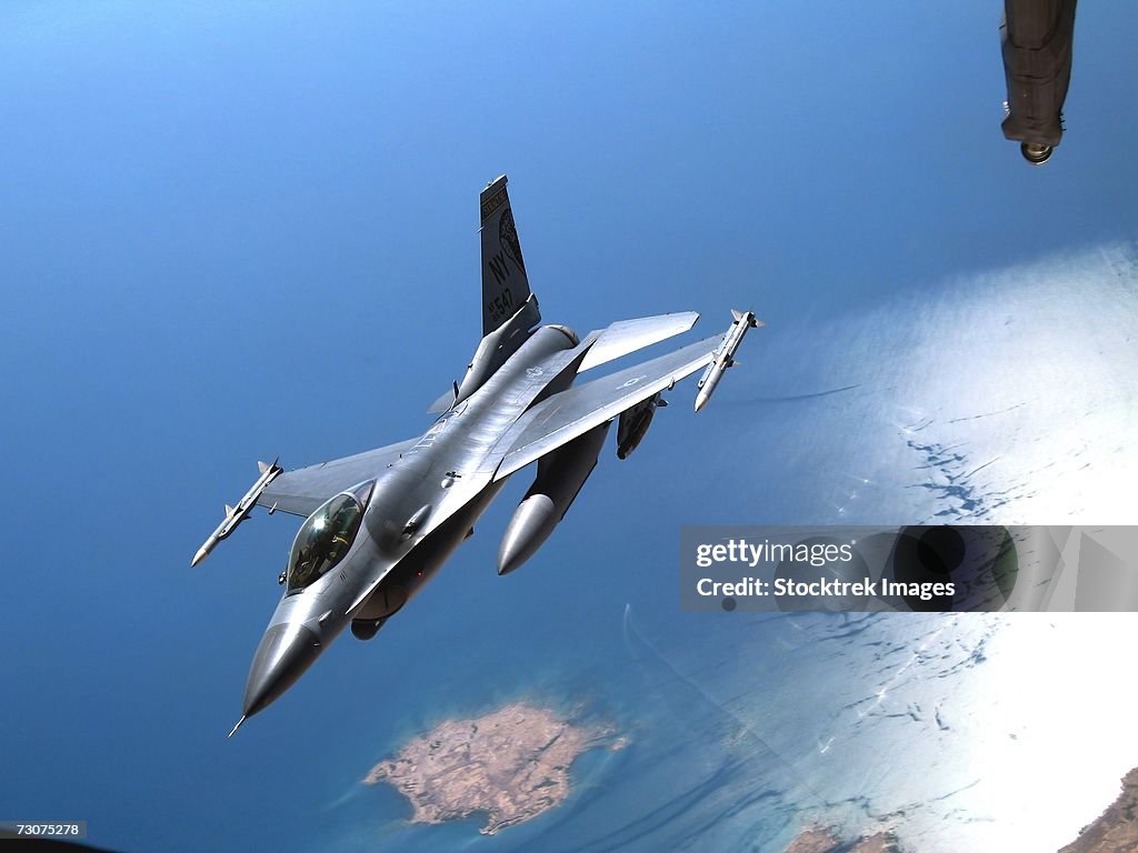 A New York Air National Guard F-16 Fighting Falcon peels off after receiving fuel from a KC-10 Extender October 17 over Southwest Asia.