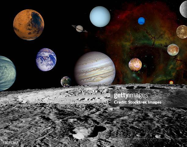 this montage of images taken by the voyager spacecraft of the planets and four of jupiter's moons is set against a false-color rosette nebula with earth's moon in the foreground. - 天王星 ストックフォトと画像