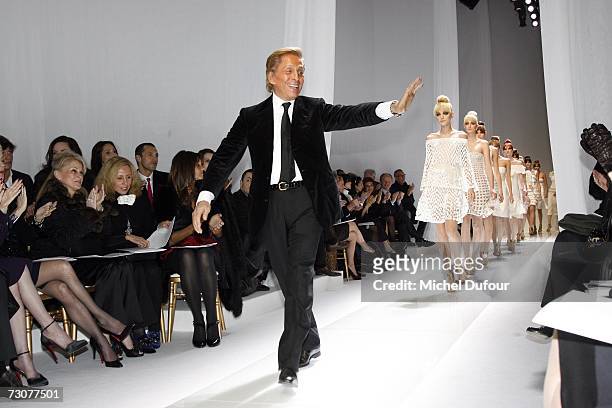 Italian fashion designer Valentino waves as he walks on the catwalk at the Valentino Fashion show, during Paris Fashion Week Haute Couture...