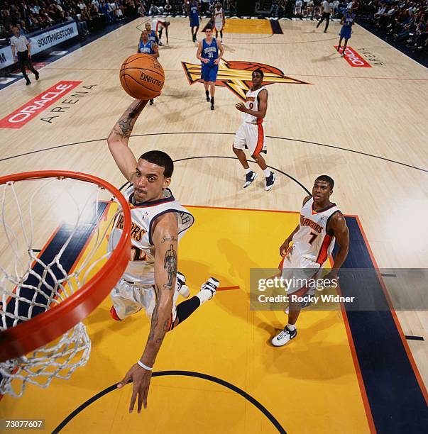 Matt Barnes of the Golden State Warriors elevates for a dunk during a game against the Orlando Magic at Oracle Arena on January 10, 2007 in Oakland,...