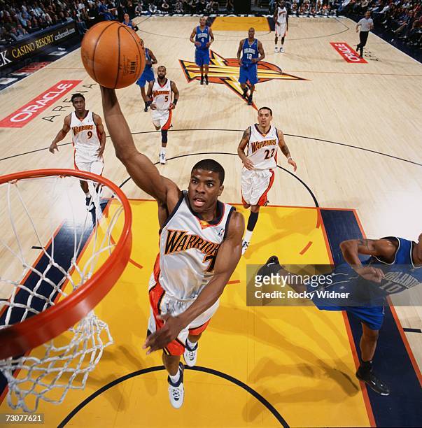 Kelenna Azubuike of the Golden State Warriors elavates for a dunk during a game against the Orlando Magic at Oracle Arena on January 10, 2007 in...