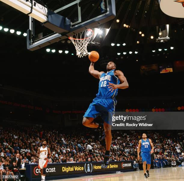 Dwight Howard of the Orlando Magic elevates to the basket for a dunk during a game against the Golden State Warriors at Oracle Arena on January 10,...