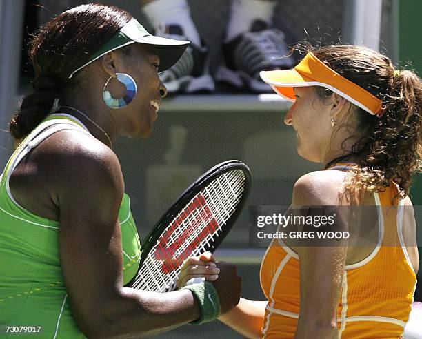 Serena Williams of the US shakes hands with Israel's Shahar Peer at the end of their women's singles quarter-final match at the Australian Open...