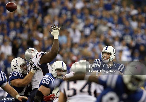 Quarterback Peyton Manning of the Indianapolis Colts passes from the pocket against the New England Patriots during the AFC Championship Game on...