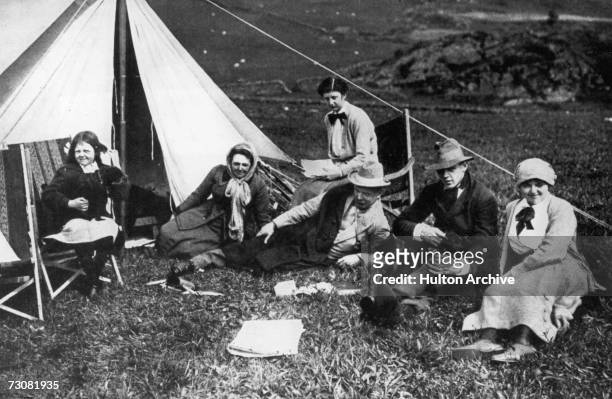 British statesman David Lloyd George camping with his family on the slopes of Moel Hebog in Snowdonia, north Wales, circa 1915. From left to right,...