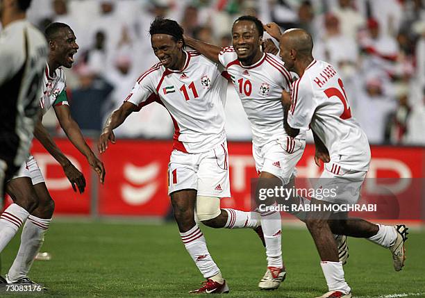 Abu Dhabi, UNITED ARAB EMIRATES: Emirati player Ismail Matar jubilates with Salem Farag and Faisal Mubarak after he scores the third goal against...