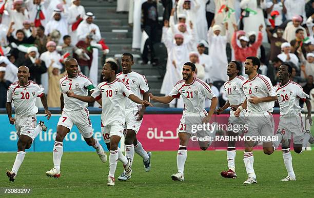 Abu Dhabi, UNITED ARAB EMIRATES: Emirati players celebrate with Ismail Matar who scores the first goal against Kuwait during their 18th Gulf Cup...